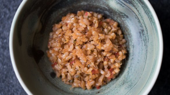 Go-to dish: Sofrito rice over house-aged wild barramundi.