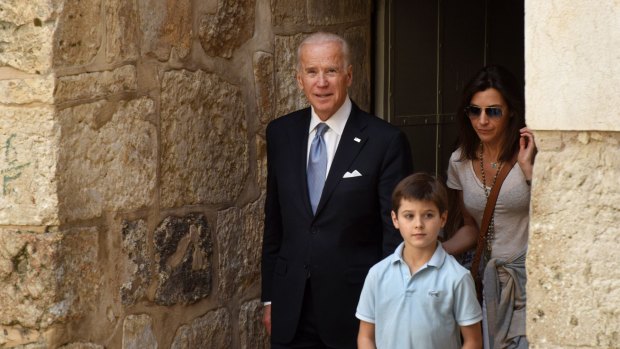 US Vice-President Joe Biden, centre, and his family visit the Church of the Holy Sepulchre in the Old City of Jerusalem, on Wednesday.
