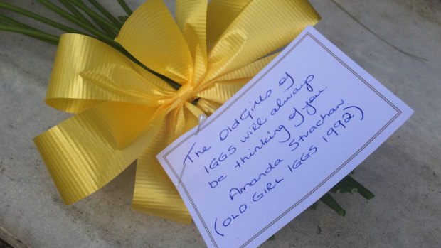 Flowers left at Allison Baden-Clay's memorial at Kholo Creek.