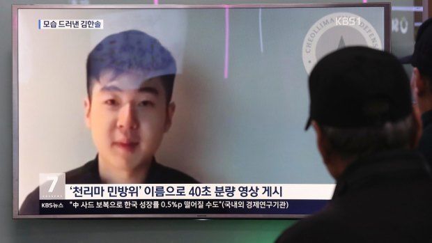 People at a railway station in Seoul, South Korea, watch a TV news program showing Kim Jong-nam's son Kim Han-sol who appeared on a YouTube video after his father's murder. 