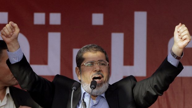 Dr Morsi, Egypt's first democratically elected president, addresses supporters in Cairo's Tahrir Square in June 2012.