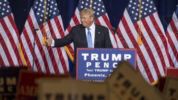 Donald Trump smiles during his Phoenix speech.