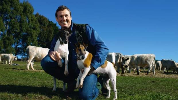 The late interior designer Stuart Rattle with his fox terriers at Musk Farm in Daylesford.