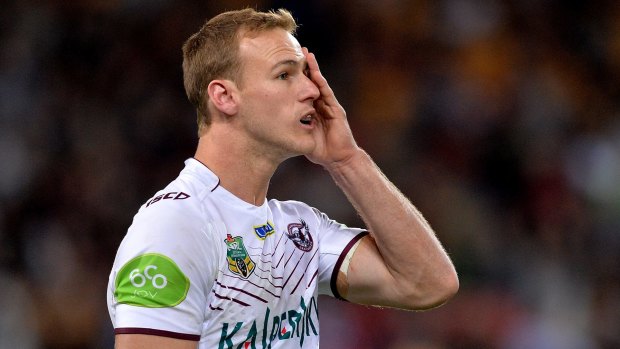 Shell-shocked: Daly Cherry-Evans can only look on as Brisbane romp home.