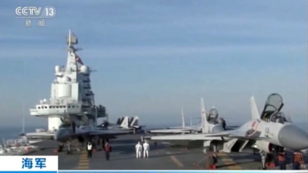 In this video still, China's aircraft carrier Liaoning is seen during live-ammunition drills in the waters of the Bohai Sea in northern China. 