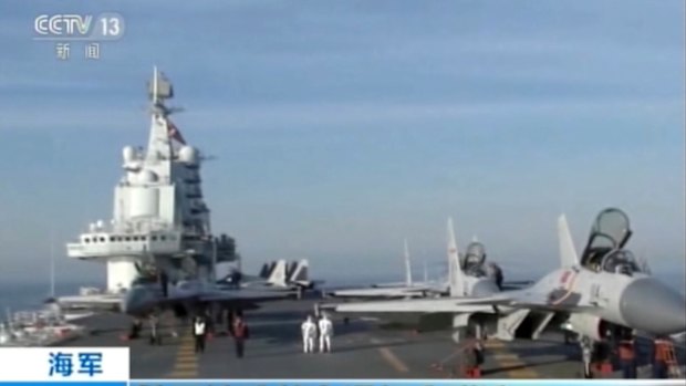 In this video still, China's aircraft carrier Liaoning is seen during live-ammunition drills in the waters of the Bohai Sea in northern China. 