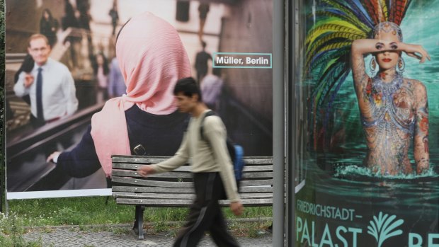 A study in contrasts in German street signs in Berlin, Germany. 