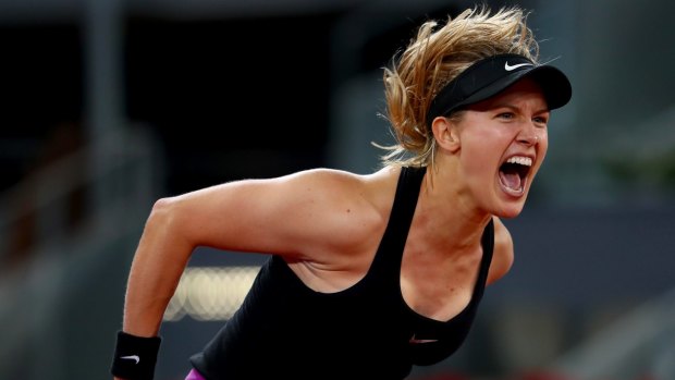 Eugenie Bouchard of Canada celebrates match point in her match against Maria Sharapova of Russia on day three of the Mutua Madrid Open.