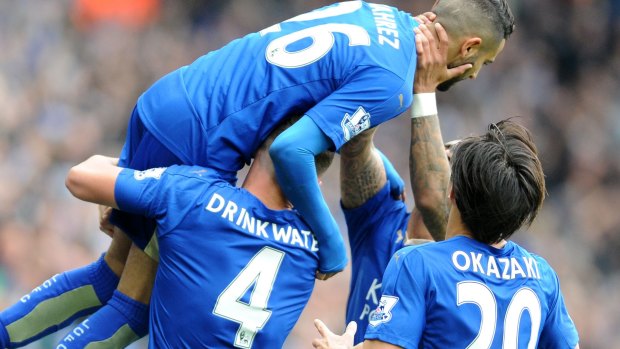 Fairytale: Leicester's Riyad Mahrez, top, celebrates after scoring against Swansea City. 