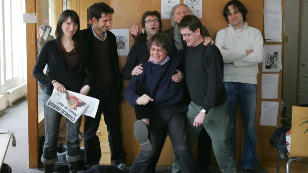 A 2006 photo of Charlie Hebdo cartoonists, including cartoonists (first row, from left) Cabu and Charb, Tignous (centre) and Honore (right) posing at the then headquarters of the weekly in Paris. 