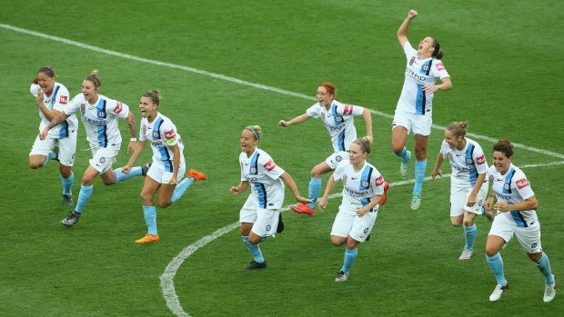 Joy and relief: Melbourne City celebrate their penalty shootout victory over Brisbane Roar.