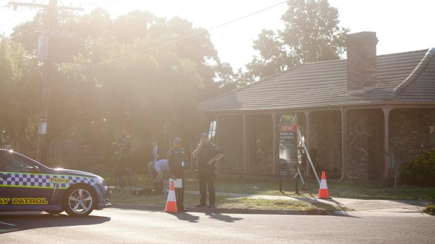 Police block the road at Kookaburra Avenue in Werribee during a siege where a man was believed to be in the house with a gun.