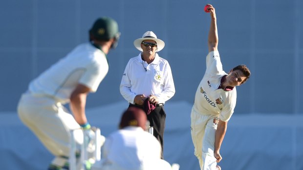 Mitchell Swepson of Queensland bowls during day one of the Sheffield Shield match against Tasmania at the Gabba.