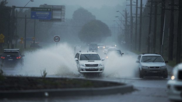 Heavy rain caused flooding across Castlereagh Road in Cranebrook on Tuesday.

