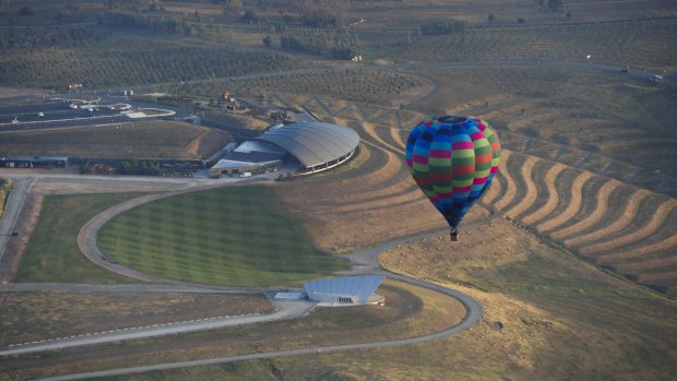 A balloon travels over the National Arboretum on Wednesday morning.