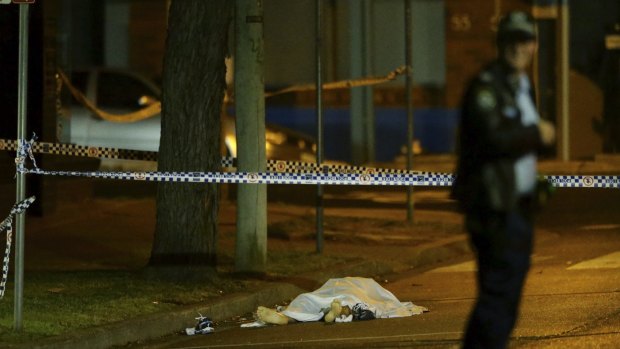 A man's body lies on the road in Lords Rd, Leichhardt