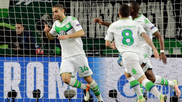 Dream start: Wolfsburg's Ricardo Rodriguez, left, celebrates after scoring the opening goal.