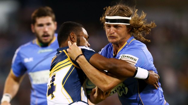 Far enough: Brumbies winger Henry Speight stops Force counterpart Nick Cummins during a match earlier this year.