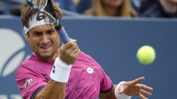 David Ferrer, of Spain, returns a shot to Juan Martin del Potro, of Argentina, during the third round of the U.S. Open tennis tournament, Saturday, Sept. 3, 2016, in New York. (AP Photo/Kathy Willens)