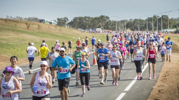 Runners take to the new Majura Parkway at the start of the 5-kilometer event during the Run For Your Lifeline Canberra Fun Run.