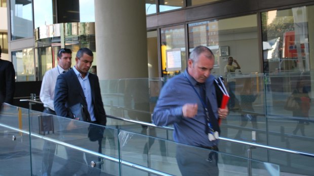 Daniel Kerr is led from a Perth court by police.