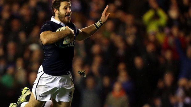 Swan dive: Tommy Seymour scores for Scotland.