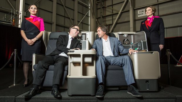 CEO Allan Joyce and designer Marc Newson demonstrate the features of the new 787-9 Dreamliner. 
