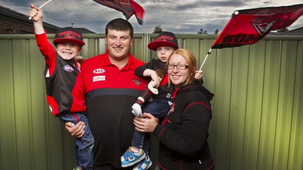 James Doolan and his wife Bek with their children (from left) Jack, 4 and Josh, 2. The family are lifetime Essendon supporters getting ready for the start of the AFL season.  