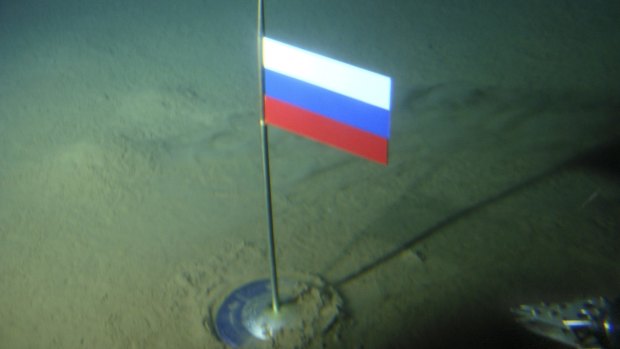 A titanium capsule with the Russian flag is seen seconds after it was planted by the Mir-1 mini submarine on the Arctic Ocean seabed under the North Pole in 2007.