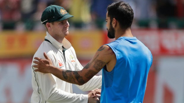 Conflict over: Steve Smith shakes hands with Virat Kohli after the fourth Test.