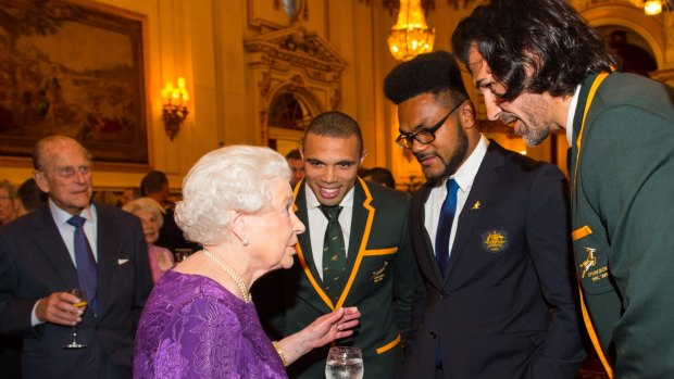 Royal audience: Queen Elizabeth II and Prince Philip with South Africa's Bryan Habana (third right),  Australia's Henry Speight and South Africa's Victor Matfield. 