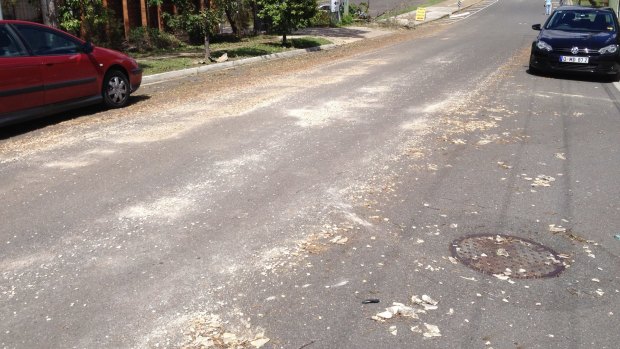 Residents fear asbestos blown into their street by the storm will become airborne.