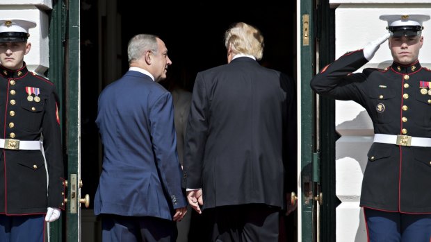 US President Donald Trump, right, and Benjamin Netanyahu, Israel's prime minister, walk into the White House in Washington, DC.