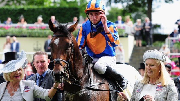 Jockey Ryan Moore celebrates after guiding Order of St George to victory in the Gold Cup at Royal Ascot in June.