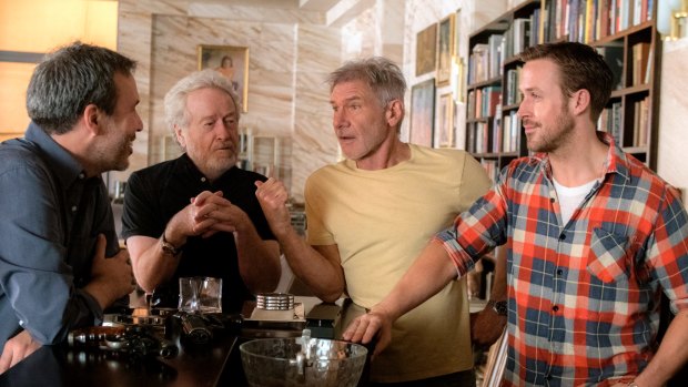 From left, Denis Villeneuve, Ridley Scott, Harrison Ford and Ryan Gosling on set.