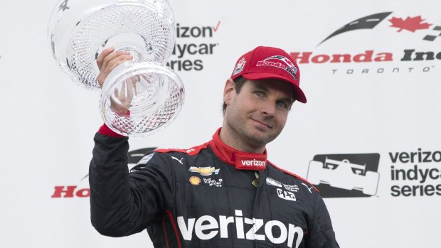 Australian driver Will Power celebrates winning the IndyCar race in Toronto.