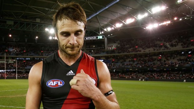 Jobe Watson leaves the field on Sunday after the 110-point thrashing by St Kilda.  He has since undergone shoulder surgery.