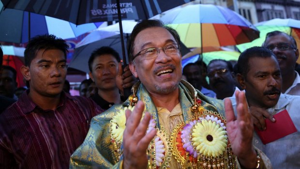 Malaysia's opposition leader Anwar Ibrahim sings on a street in Klang, near Kuala Lumpur, as part of a campaign to seek support ahead of his final appeal against a conviction for sodomy. 