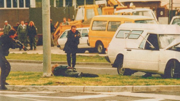 Hitman Stephen Asling lies prostrate as Special Operations Group members approach during Melbourne's underworld wars. The SOG trains for hundreds of violent scenarios.