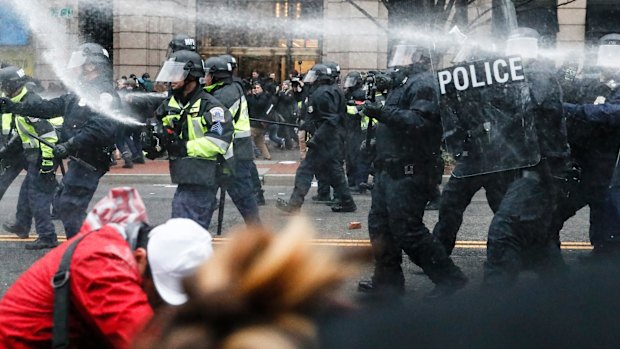 Protests at the Trump inauguration. US President Donald Trump has reportedly told UK Prime Minister Theresa May that he will not visit the UK if there is a risk of protests.