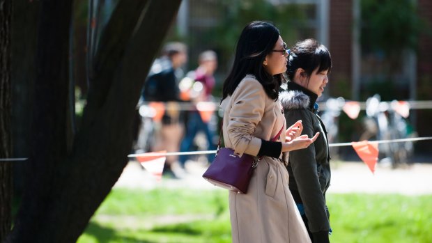 Students walking on the ANU campus on Wednesday. 