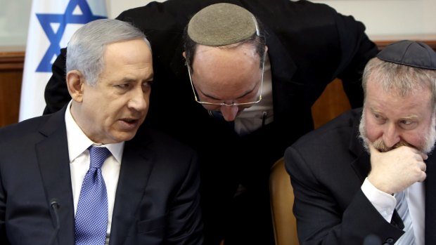 Benjamin Netanyahu and Avichai Mandelblit with Foreign Ministry director-general Dore Gold, centre,  in 2015. Will the close association between the PM and Mandelblit influence the man who is now attorney-general?