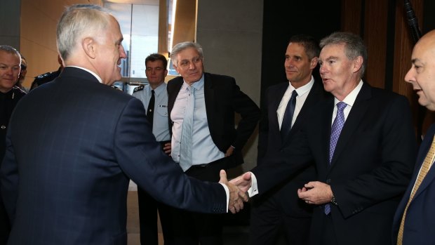 Prime Minister Malcolm Turnbull greets ASIO director-general Duncan Lewis earlier this month. 