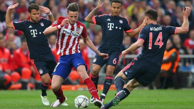 Solo effort: Saul Niguez of Atletico Madrid gets the better of Juan Bernat, Thiago Alcantara and Xabi Alonso to score the only goal.