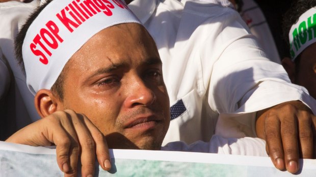 A Rohingya man living in Malaysia cries during a December 4 protest in Kuala Lumpur against the persecution of Rohingyas in Myanmar.