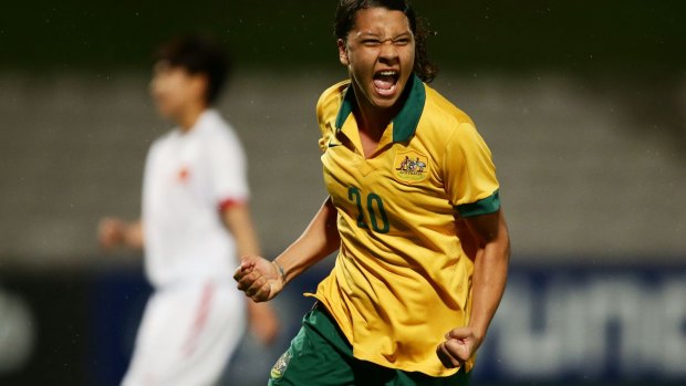 On target: Samantha Kerr wheels away in celebration after netting in the 11-0 rout.