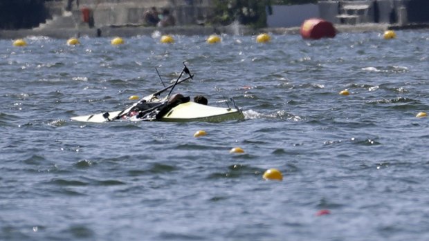 A Serbian pair capsize while competing,