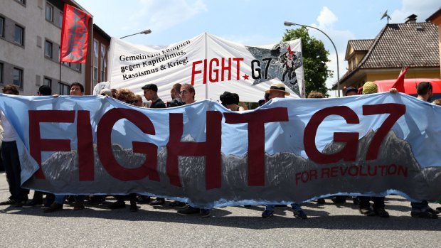 Anti-G7 protesters clash with police during a rally ahead of the G7 meetings in the German Alps.