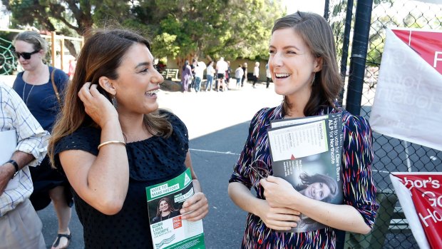 Greens candidate Lidia Thorpe and Labor candidate Clare Burns cross paths at Thornbury primary school on Saturday.