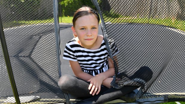 Orla Morrison-Brown, 9, broke both bones in her right arm getting off a trampoline.
